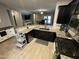 Open concept kitchen with granite counters, stainless appliances, and an island with seating at 330 W Evergreen Pear Ave, Queen Creek, AZ 85140