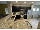 Stylish kitchen featuring granite countertops, modern appliances and dark cabinetry at 330 W Evergreen Pear Ave, Queen Creek, AZ 85140