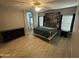 Large bedroom with ceiling fan, wood-look flooring, and plenty of natural light at 330 W Evergreen Pear Ave, Queen Creek, AZ 85140