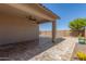 The home has a spacious covered patio that leads to the pool at 33207 N Slate Creek Dr, San Tan Valley, AZ 85143
