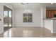 Open dining area featuring tile flooring, a chandelier, and sliding glass doors to outdoor patio at 33207 N Slate Creek Dr, San Tan Valley, AZ 85143