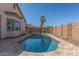 Sparkling pool surrounded by decorative stone and landscaping, perfect for relaxation and recreation at 33207 N Slate Creek Dr, San Tan Valley, AZ 85143