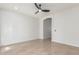 Bright room features neutral tile flooring, ceiling fan, and open doorway with access to other rooms at 33207 N Slate Creek Dr, San Tan Valley, AZ 85143