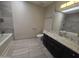Bathroom featuring tile floors, a shower/tub combination, and a vanity sink with a white countertop at 3810 W Yucca St, Phoenix, AZ 85029