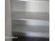 Empty white shelving with room for storage, perfect for organizing belongings in a closet at 3810 W Yucca St, Phoenix, AZ 85029