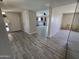 View of open floor plan showing tile flooring and views to a dining area and the kitchen at 3810 W Yucca St, Phoenix, AZ 85029