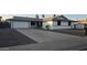 Charming single-story home featuring a well-manicured front yard, long driveway, and an attached two-car garage at 3810 W Yucca St, Phoenix, AZ 85029
