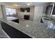 Modern kitchen featuring granite countertops, stainless steel sink, dark cabinets, tile floor and a breakfast nook at 3810 W Yucca St, Phoenix, AZ 85029