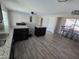 Well-lit kitchen with dark cabinetry, light granite countertops, breakfast bar, and open concept design at 3810 W Yucca St, Phoenix, AZ 85029