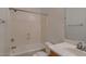 Simple bathroom with tub and shower combination with a basic sink and toilet at 42625 W Sandpiper Dr, Maricopa, AZ 85138