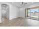 Bright bedroom with hardwood floors, large windows, a ceiling fan, and ensuite bathroom at 4314 E Bernice St, Gilbert, AZ 85295