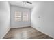 Bright bedroom with sleek vinyl floors, bright windows, and neutral walls; a modern space at 4314 E Bernice St, Gilbert, AZ 85295