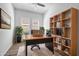 Bright office space featuring a large desk, stylish shelving, and ample natural light for productivity at 4314 E Bernice St, Gilbert, AZ 85295