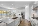 Bright modern kitchen with white cabinets, stone countertops, stainless steel appliances and decor at 4314 E Bernice St, Gilbert, AZ 85295