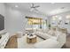 Stylishly furnished living room with a view of the backyard through sliding glass doors, modern lighting at 4314 E Bernice St, Gilbert, AZ 85295
