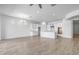 Spacious open-concept design featuring the living and kitchen areas with modern lighting and hardwood floors at 4314 E Bernice St, Gilbert, AZ 85295