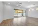 Bright, open living room with a sliding glass door leading to the backyard and modern lighting at 4314 E Bernice St, Gilbert, AZ 85295