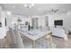 Virtual staging showing a dining area and kitchen with table and chairs in a bright living room at 4314 E Bernice St, Gilbert, AZ 85295