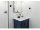 Modern bathroom featuring quartz countertops, black hardware, and white subway tile at 48 S Catalina St, Gilbert, AZ 85233