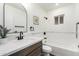 Bright bathroom featuring a shower-tub, white subway tile, and updated fixtures at 48 S Catalina St, Gilbert, AZ 85233
