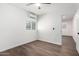 Clean bedroom with laminate flooring, mini-split AC unit, and bright natural light at 48 S Catalina St, Gilbert, AZ 85233