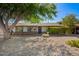 Charming single-story home with a well-maintained front yard with mature tree offering shade at 48 S Catalina St, Gilbert, AZ 85233