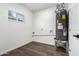 Utility room with laminate wood flooring and hot water heater at 48 S Catalina St, Gilbert, AZ 85233