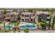 Aerial view of a home with a backyard pool, spa, and well-maintained landscaping at 5051 S Moccasin Trl, Gilbert, AZ 85298