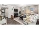 Cozy living room features shiplap accent wall, electric fireplace, and comfortable seating area with natural light at 5051 S Moccasin Trl, Gilbert, AZ 85298