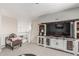 Spacious living room features a large entertainment center and comfortable seating at 5051 S Moccasin Trl, Gilbert, AZ 85298