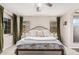 Spacious main bedroom with a neutral color palette, plush bedding, and plenty of natural light at 5051 S Moccasin Trl, Gilbert, AZ 85298