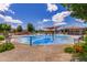 A colorful splash pad with various water features for , surrounded by a shaded picnic area and benches at 5051 S Moccasin Trl, Gilbert, AZ 85298