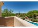 Beautiful backyard view featuring a pristine pool surrounded by lush desert landscaping at 6010 E Languid Ln, Carefree, AZ 85377