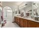 Double vanity bathroom with mirrors and walk-in shower stall at 6010 E Languid Ln, Carefree, AZ 85377