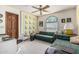 Cozy bedroom with a quilt wall hanging, arched window, and unique furnishings at 6010 E Languid Ln, Carefree, AZ 85377