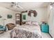 Bedroom features a ceiling fan, closet, a quaint window view, and comfortable furnishings at 6010 E Languid Ln, Carefree, AZ 85377