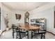Elegant dining room with a large wooden table and unique mirrored display cabinet at 6010 E Languid Ln, Carefree, AZ 85377