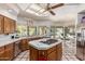 Spacious kitchen with island cooktop, stainless steel appliances, and bright natural light at 6010 E Languid Ln, Carefree, AZ 85377