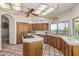 Bright kitchen with an island cooktop, abundant cabinet space, and scenic desert views at 6010 E Languid Ln, Carefree, AZ 85377