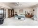 Bedroom featuring a comfortable bed, access to a balcony, and bright natural light at 6010 E Languid Ln, Carefree, AZ 85377