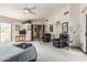Bright and airy main bedroom featuring neutral carpeting, fan, and private balcony access at 6010 E Languid Ln, Carefree, AZ 85377