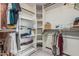 Organized walk-in closet featuring built-in shelving, hanging racks, and ample storage space at 6010 E Languid Ln, Carefree, AZ 85377