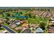 Overhead view showcasing a community with golf courses, lakes, well-maintained homes, and lush greenery at 631 Leisure World --, Mesa, AZ 85206