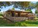Spacious backyard featuring a covered patio area and well-maintained lawn at 631 Leisure World --, Mesa, AZ 85206