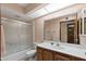 Bathroom with vanity, large mirror, shower/tub combo and neutral finishes at 631 Leisure World --, Mesa, AZ 85206