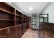 Walk-in closet with extensive shelving and drawer space for optimal organization and storage at 631 Leisure World --, Mesa, AZ 85206