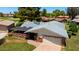 Aerial view of home featuring gray shingled roof, two-car garage, and a covered patio at 631 Leisure World --, Mesa, AZ 85206