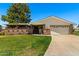 Charming single-story home featuring a well-manicured lawn, covered porch, and inviting curb appeal at 631 Leisure World --, Mesa, AZ 85206