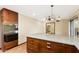 Bright kitchen area featuring a large island with granite counters and built-in oven at 631 Leisure World --, Mesa, AZ 85206