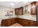 Well-lit kitchen featuring granite countertops, stainless steel appliances, and updated cabinetry at 631 Leisure World --, Mesa, AZ 85206